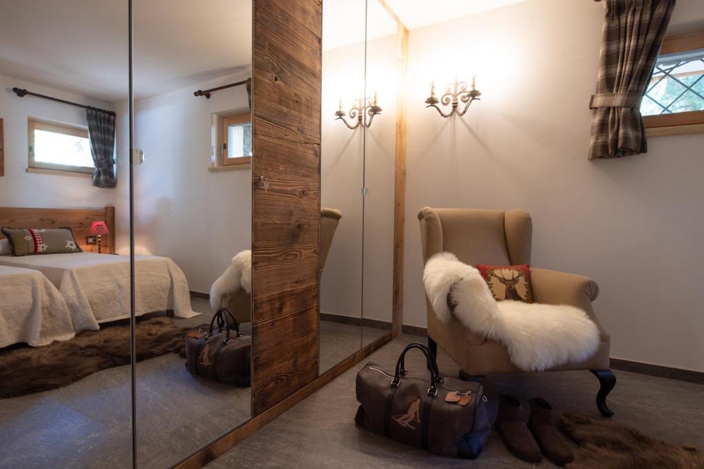 Postel nebo postele na pokoji v ubytování Chalet degli Abeti by AMA Val di Fassa
