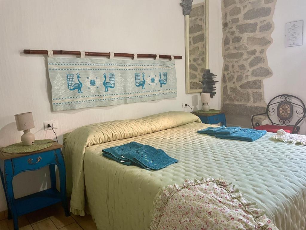 Postel nebo postele na pokoji v ubytování B&B Pascal House Nuoro_IUN E5016