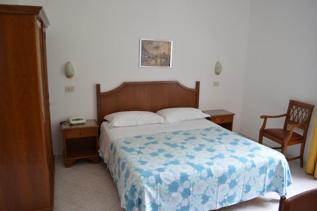 Postel nebo postele na pokoji v ubytování Hotel Maronti