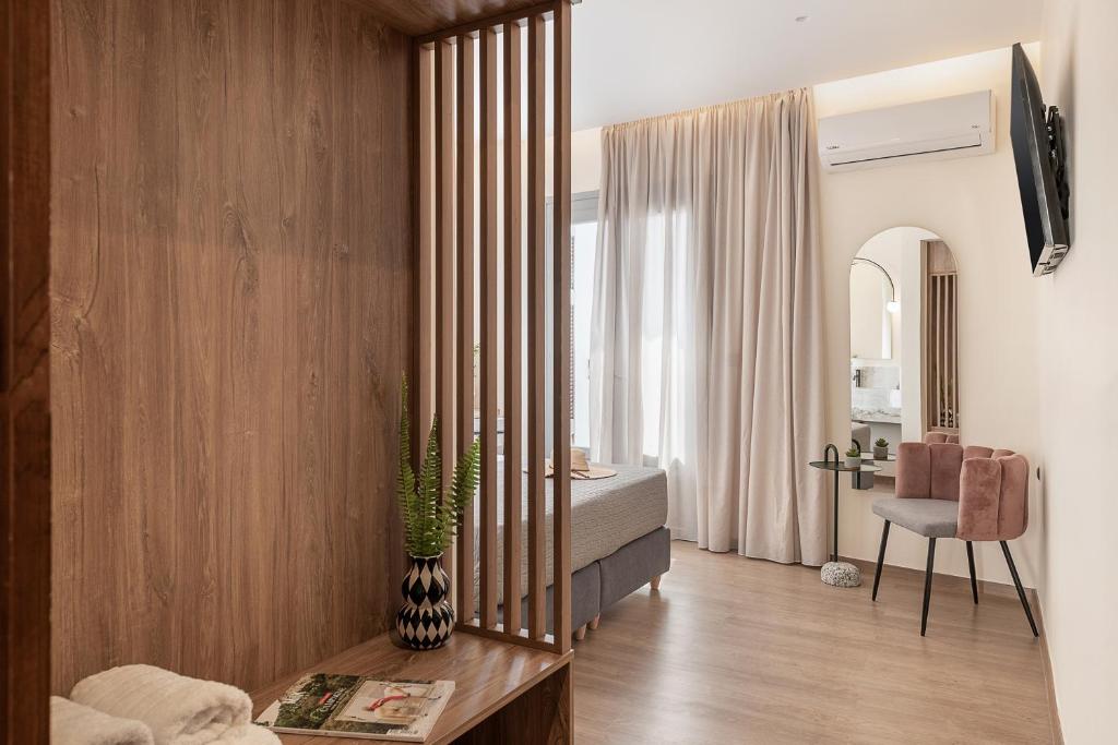 TV a/nebo společenská místnost v ubytování Amphitrite Hotel