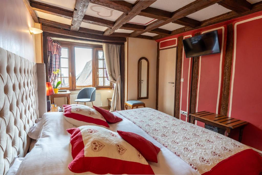 Postel nebo postele na pokoji v ubytování Hotel à l'Oriel