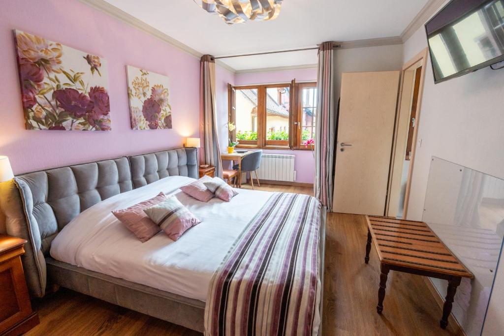 Postel nebo postele na pokoji v ubytování Hotel à l'Oriel