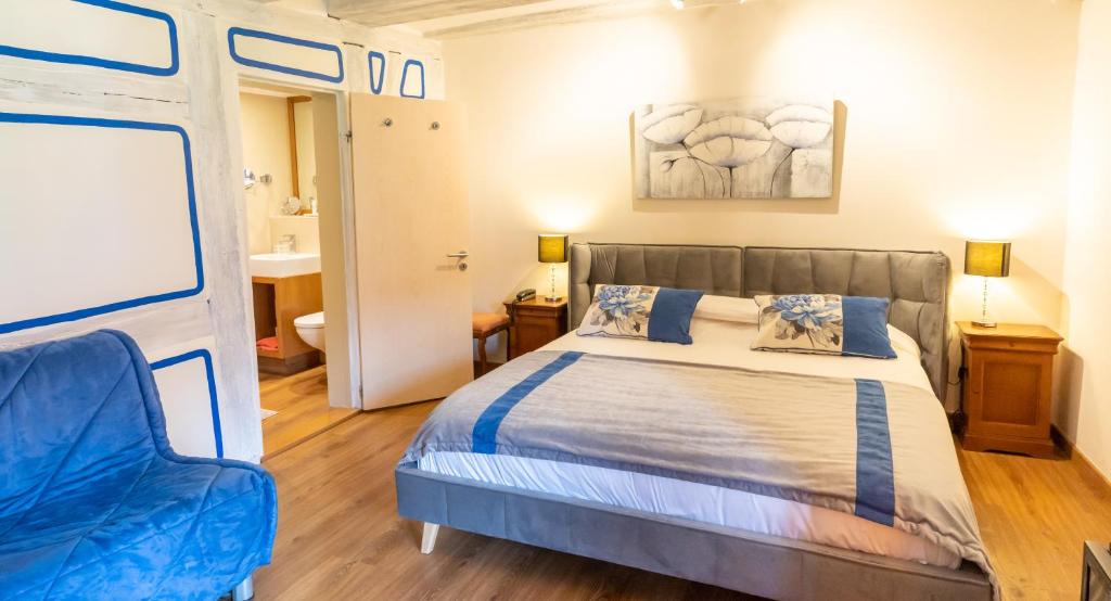 Postel nebo postele na pokoji v ubytování Hotel à l'Oriel