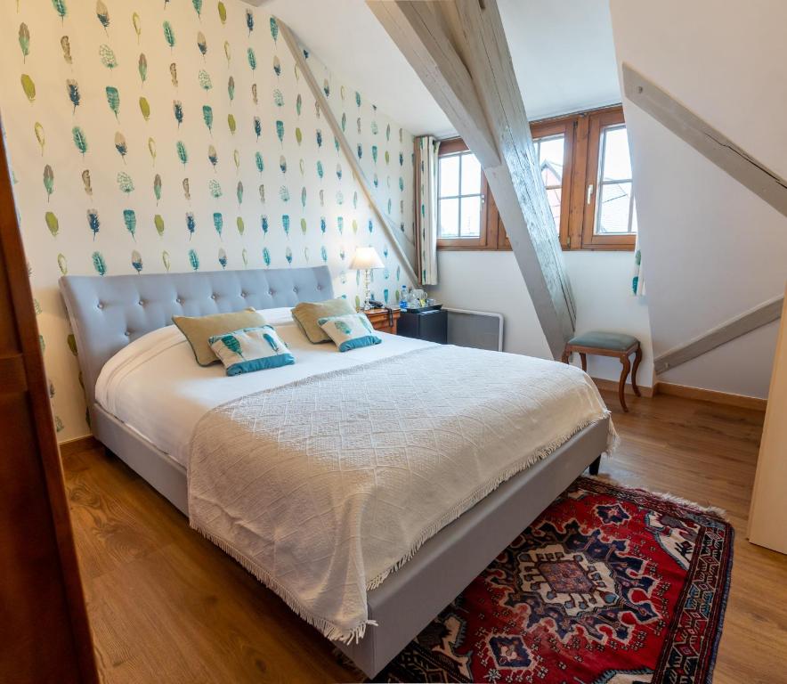Postel nebo postele na pokoji v ubytování Hotel à l'Oriel