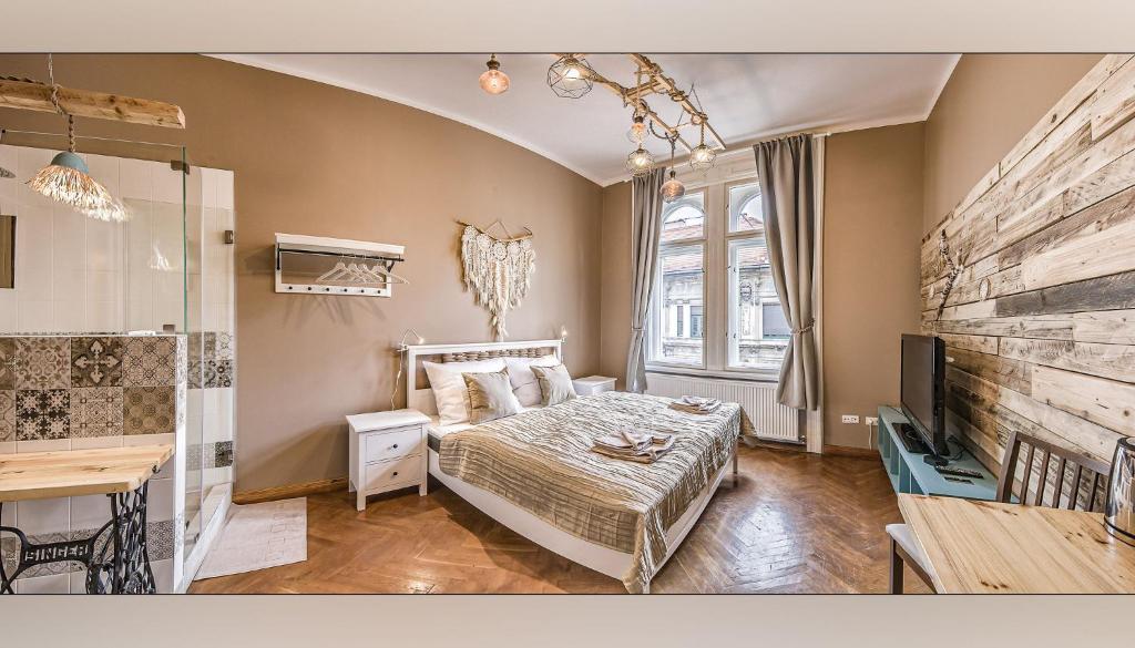 Postel nebo postele na pokoji v ubytování Boutique Suites Ráday