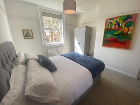 a bedroom with a bed with a pillow on it at Coastal Corner in Mundesley