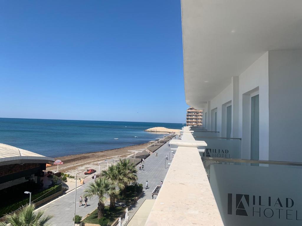 a view of the beach from the balcony of a hotel at Iliad Hotel in Durrës