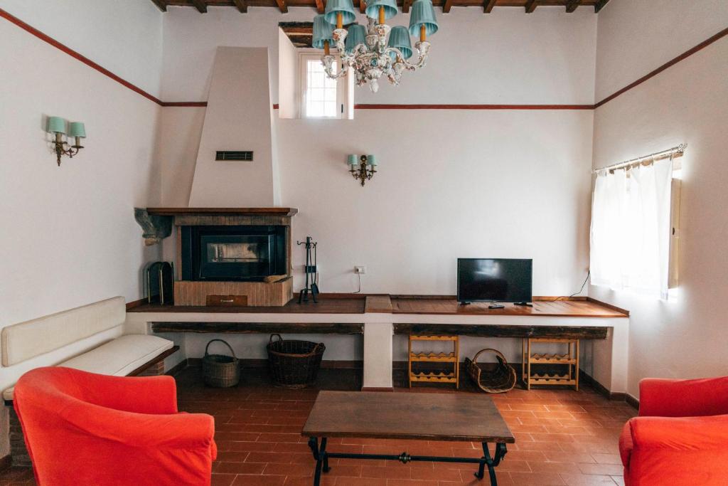 Televízia a/alebo spoločenská miestnosť v ubytovaní Tenuta San Giovanni Lucca - Borgo del Locumone