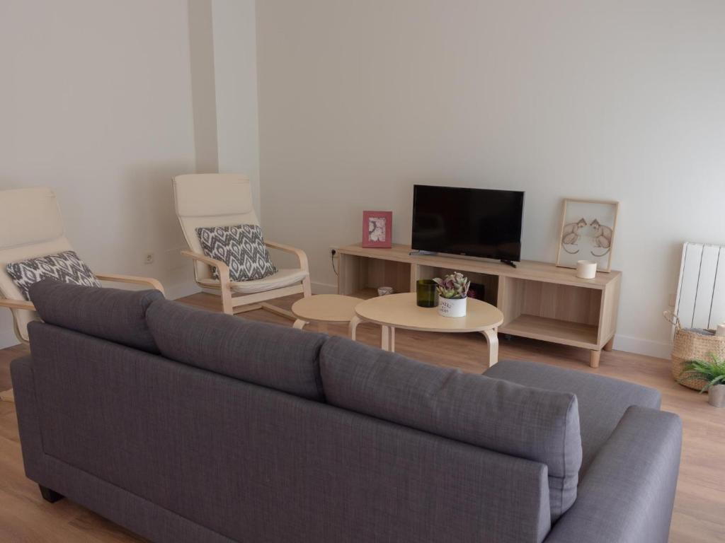 A television and/or entertainment centre at Housingcoruña sada playa