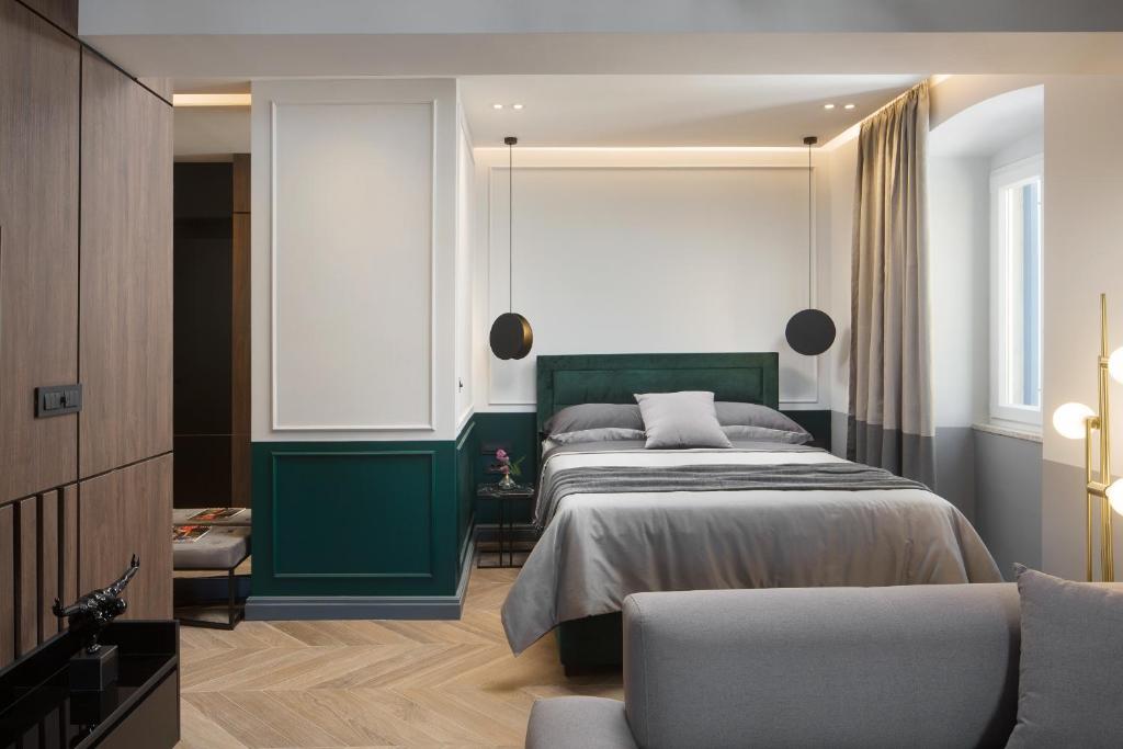Posteľ alebo postele v izbe v ubytovaní Borgo Apartment