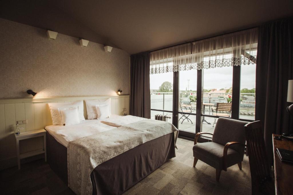 Postel nebo postele na pokoji v ubytování Promenade Hotel Liepaja