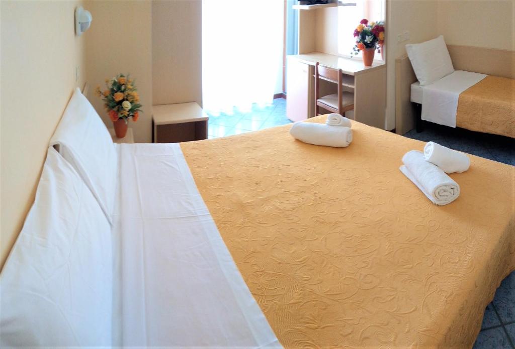 Postel nebo postele na pokoji v ubytování Hotel Corona