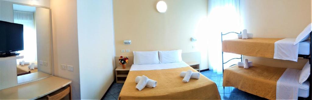Postel nebo postele na pokoji v ubytování Hotel Corona