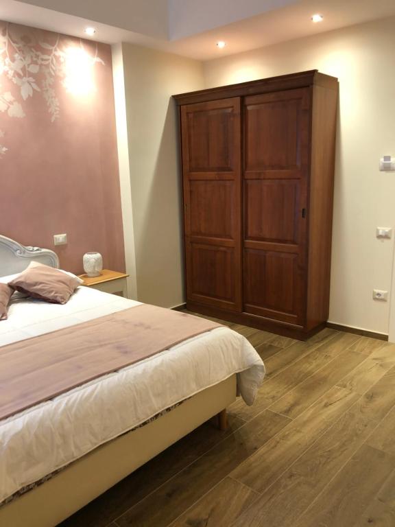Postel nebo postele na pokoji v ubytování CAVALIERE suite & rooms