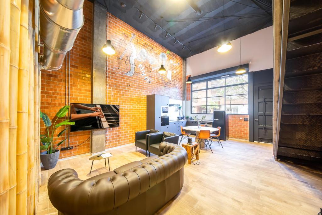 TV a/nebo společenská místnost v ubytování ART LOFTS Valencia by Benisur