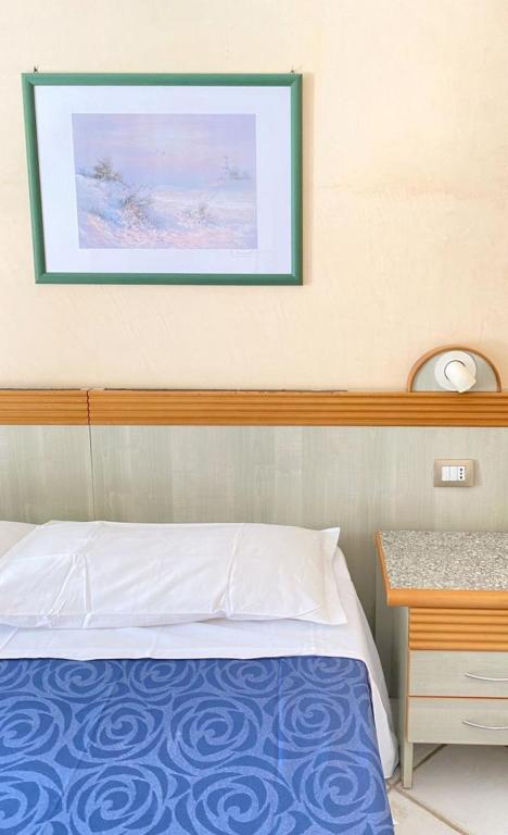Postel nebo postele na pokoji v ubytování Tramonti Residence
