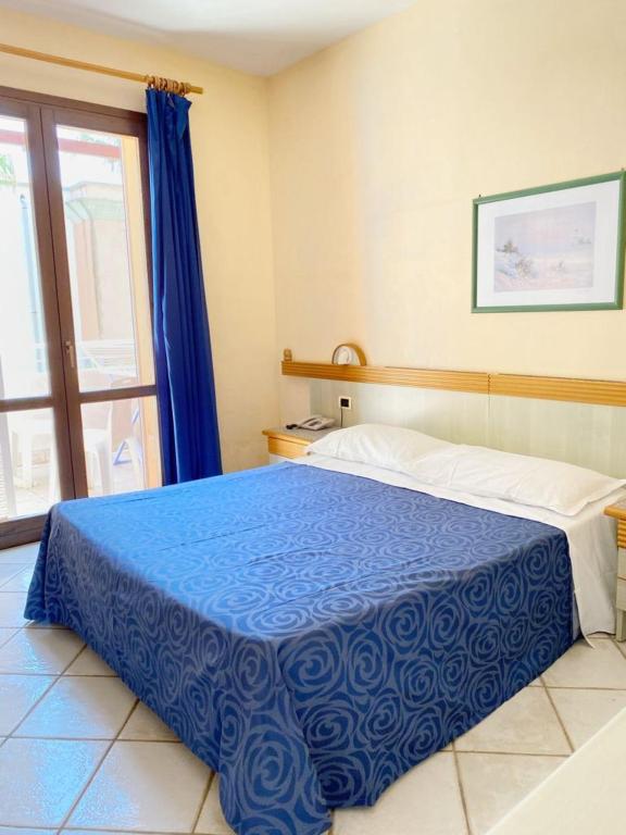 Postel nebo postele na pokoji v ubytování Tramonti Residence