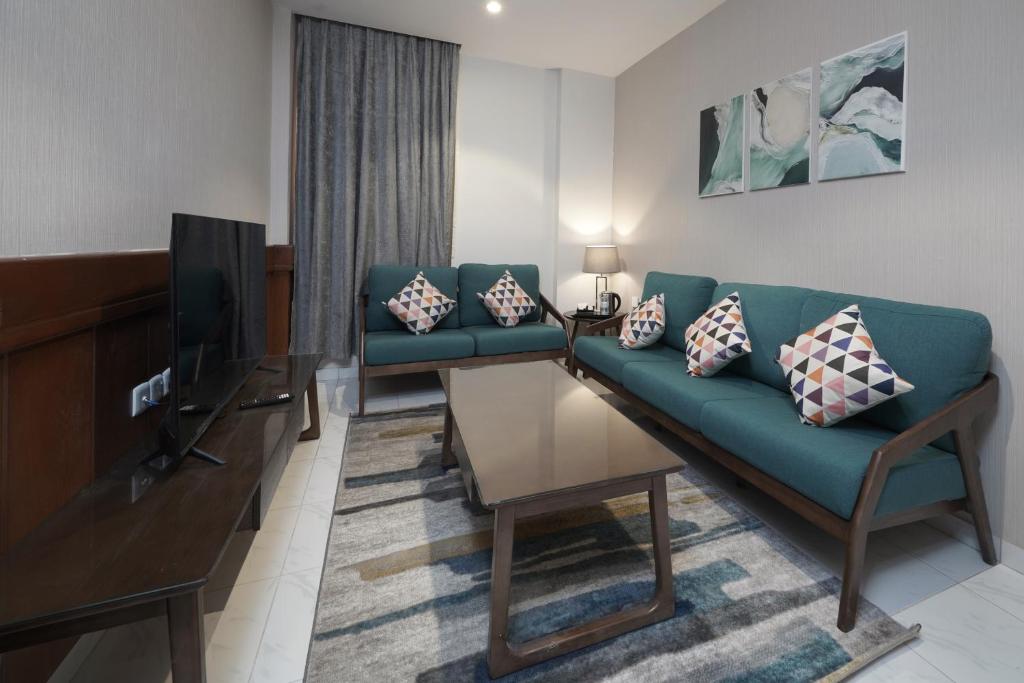 TV a/nebo společenská místnost v ubytování Biz Hotel Apartments