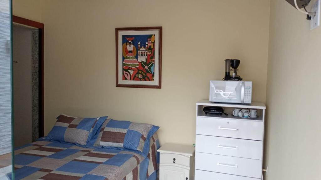 Postel nebo postele na pokoji v ubytování GARATUCAIA - Suites Casa de Madeira