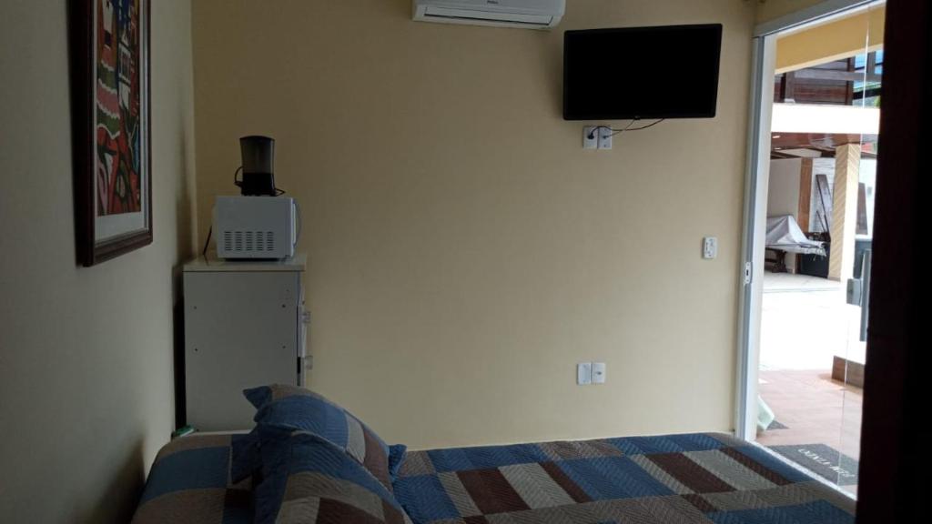 TV a/nebo společenská místnost v ubytování GARATUCAIA - Suites Casa de Madeira