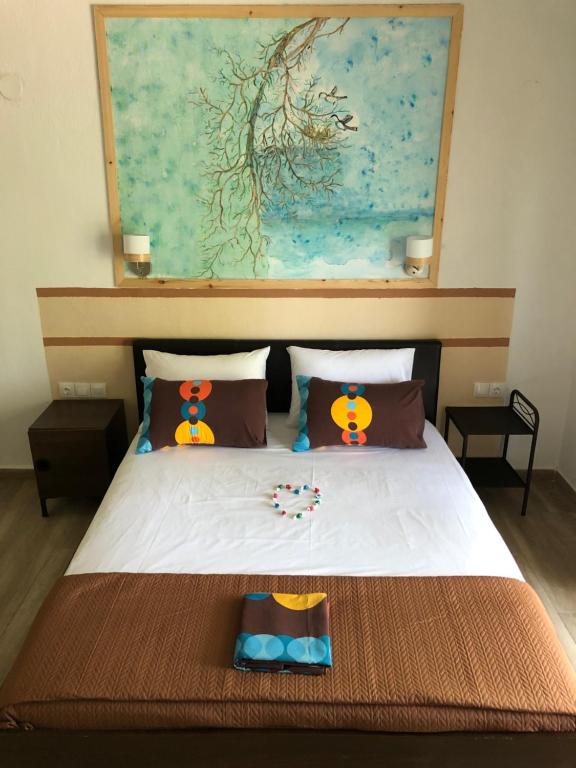 Postel nebo postele na pokoji v ubytování Enigma Suites