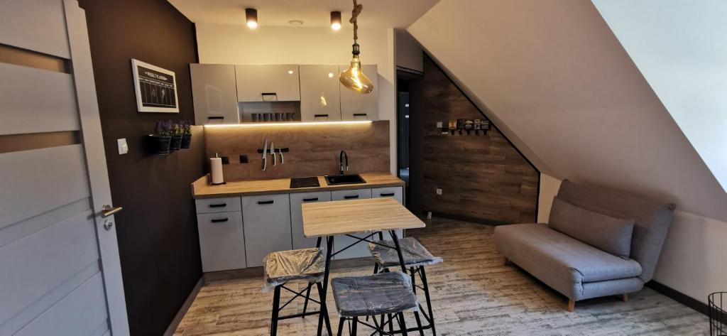 Kuchyňa alebo kuchynka v ubytovaní Apartamenty Majówka