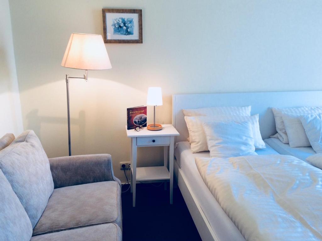 Postel nebo postele na pokoji v ubytování Hotel Rhein-Residenz