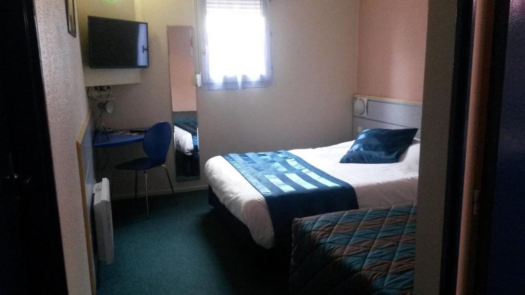 Postel nebo postele na pokoji v ubytování As Hotel Orléans Nord Artenay