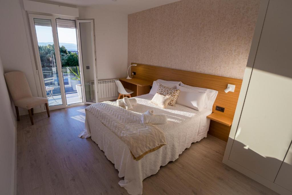 Posteľ alebo postele v izbe v ubytovaní Balcón de Arousa - Vistas a las Rias Baixas