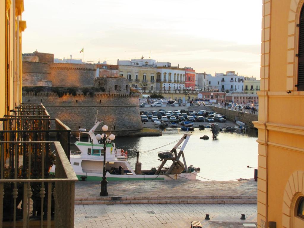a boat is docked in the water in a harbor at B&B Dei Bottai in Gallipoli