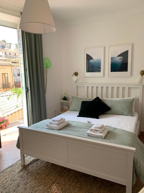 Postel nebo postele na pokoji v ubytování Pizzo Central House