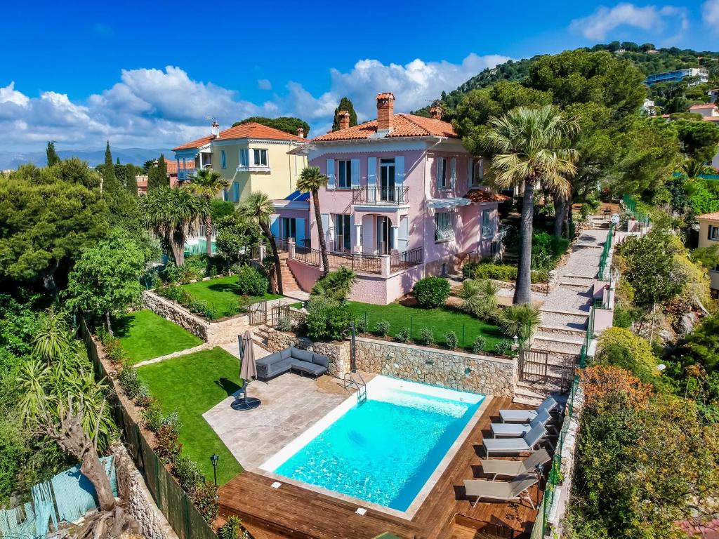 an aerial view of a house with a swimming pool at Stunning seaview villa. Villefranche Sur Mer in Villefranche-sur-Mer