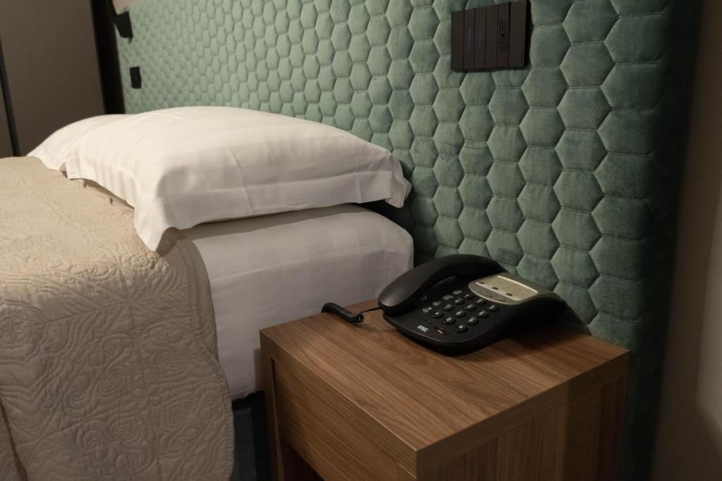 Кровать или кровати в номере Hotel Graziella