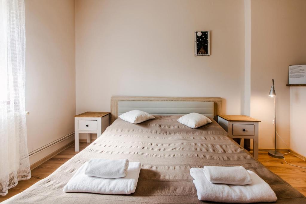 Posteľ alebo postele v izbe v ubytovaní Apartament Grota