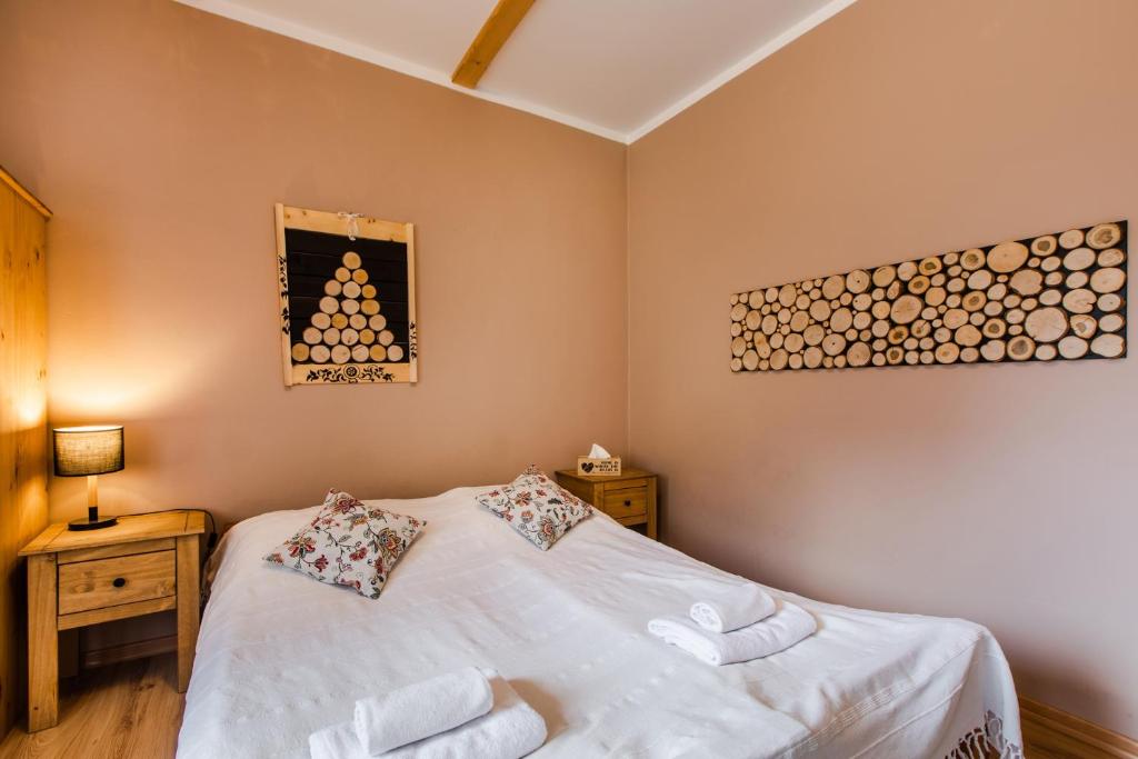 Posteľ alebo postele v izbe v ubytovaní Apartament Grota