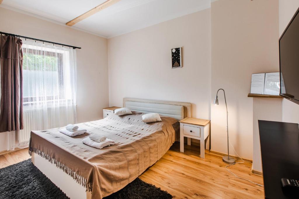 Posteľ alebo postele v izbe v ubytovaní Apartament Grota