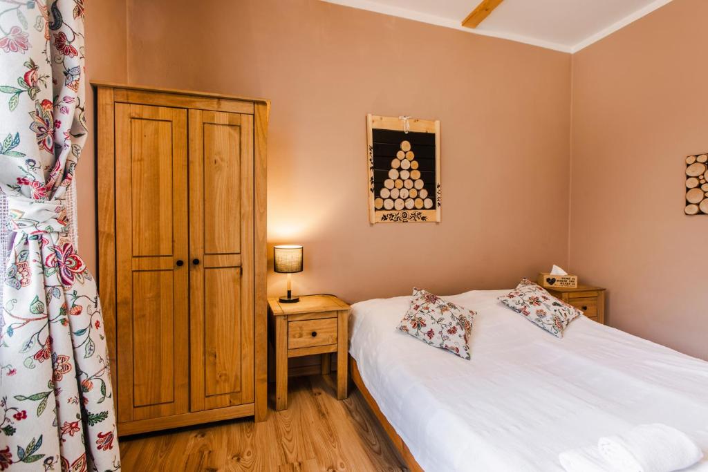 Posteľ alebo postele v izbe v ubytovaní Apartament Grota