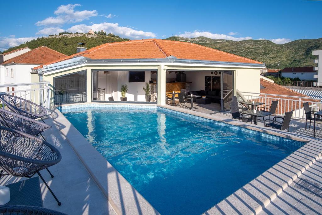 a swimming pool on top of a house at Apartments Sweet Dreams in Trebinje