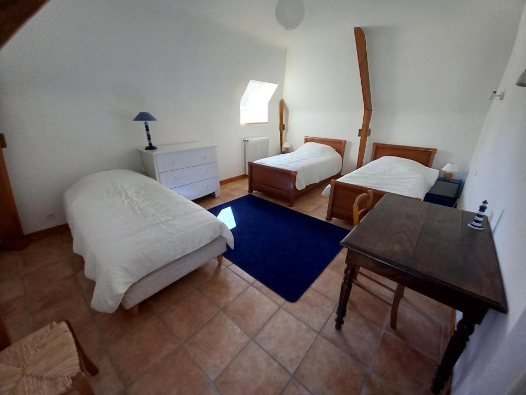 Postel nebo postele na pokoji v ubytování l'orangerie