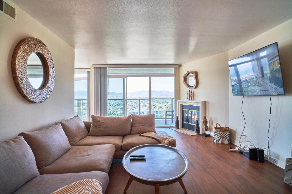 a living room with a couch and a table at Venice Beach Property With Water Views in Los Angeles