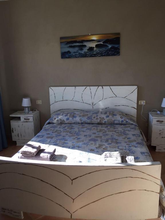 Postel nebo postele na pokoji v ubytování Sardegna Mer et Soleil in Olbia