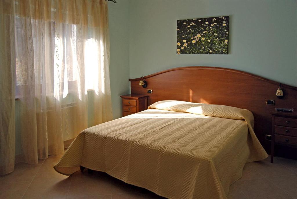 Postel nebo postele na pokoji v ubytování B&B Angela