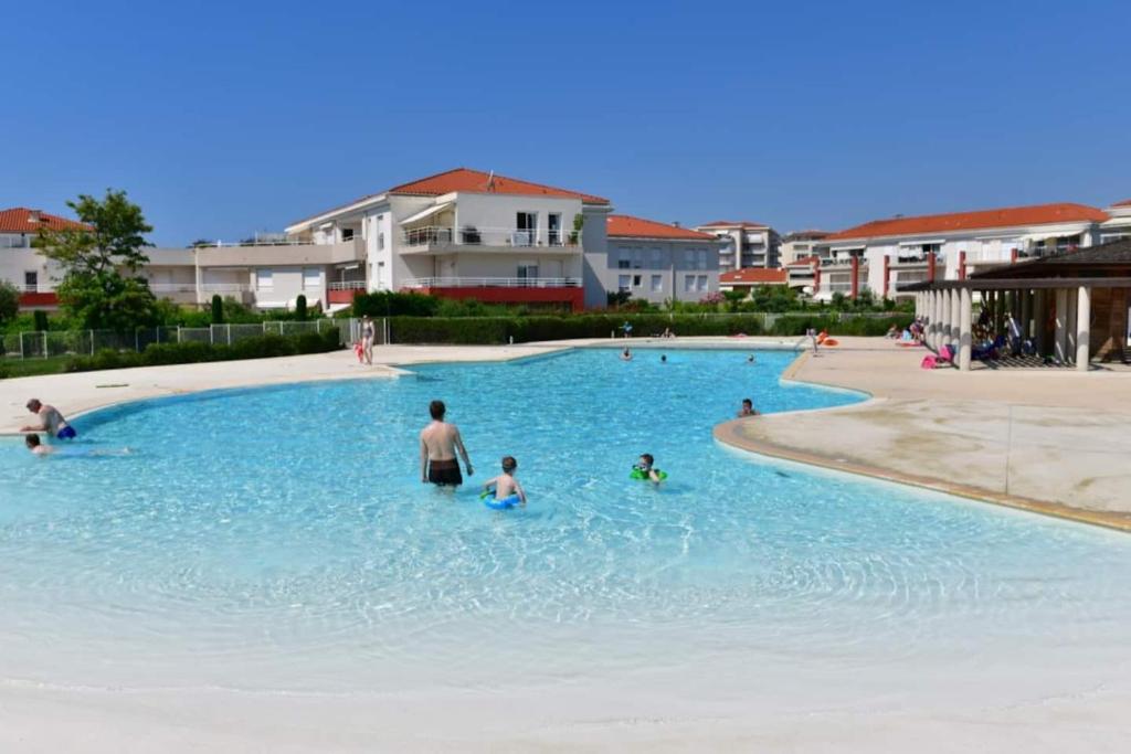 a group of people in a swimming pool at Domaine Juan Flore in Antibes