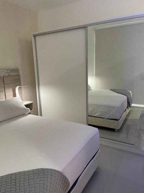 Postel nebo postele na pokoji v ubytování Asuncion Gracia Suites