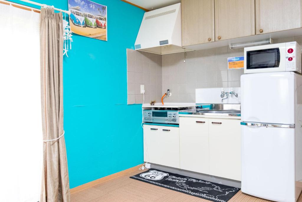 Kuchyň nebo kuchyňský kout v ubytování Seaside Pension Petit Shirahama