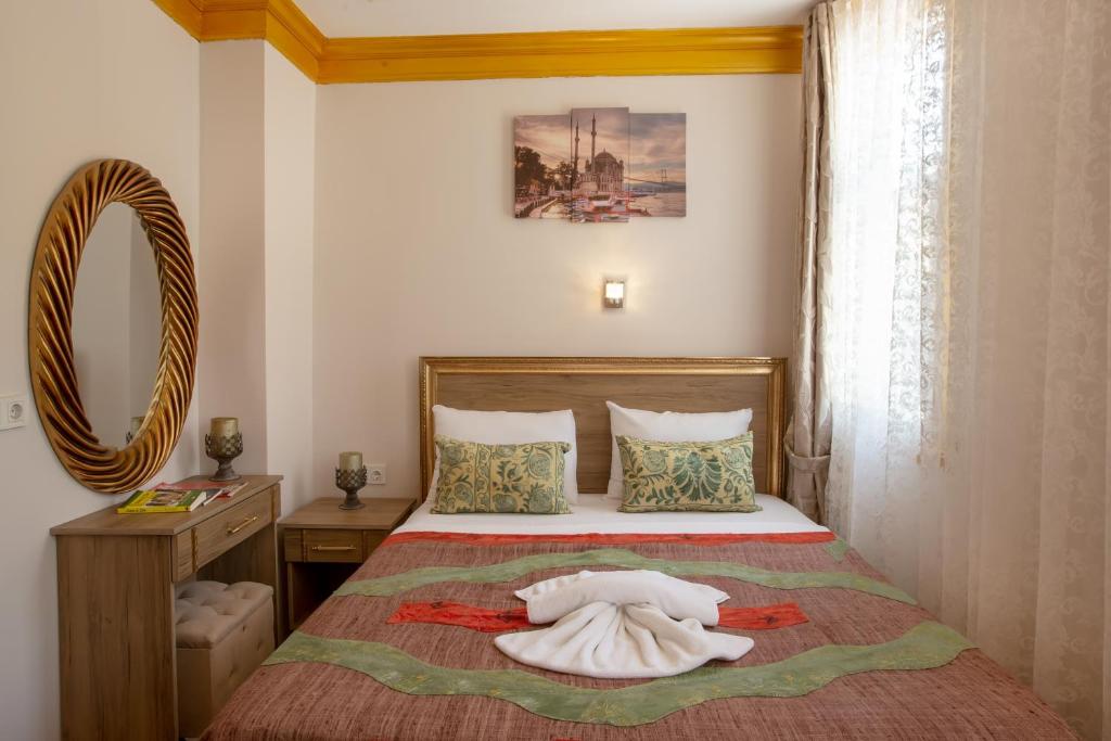Postel nebo postele na pokoji v ubytování April Story Apart Hotel