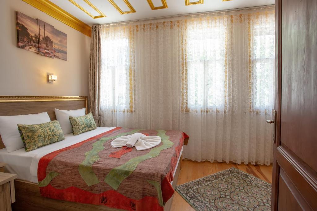 Postel nebo postele na pokoji v ubytování April Story Apart Hotel