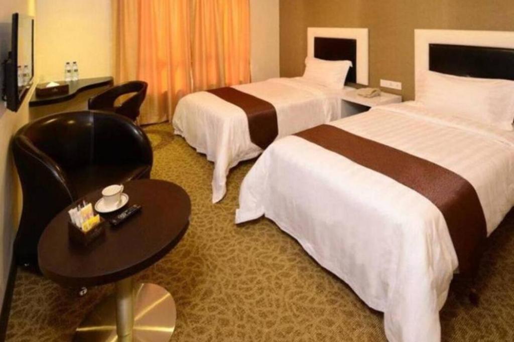 Postel nebo postele na pokoji v ubytování Hotel Nusa CT