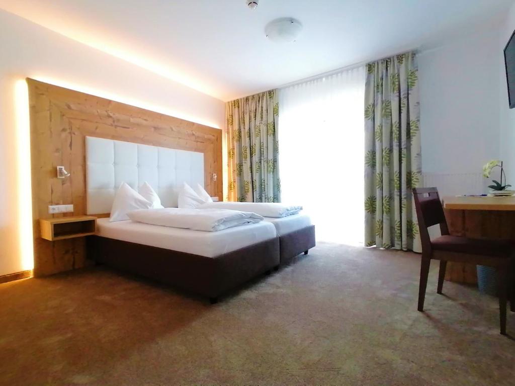 Voodi või voodid majutusasutuse Hotel Berghof toas