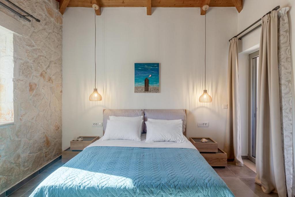 Postel nebo postele na pokoji v ubytování Tierra Olivo Villas